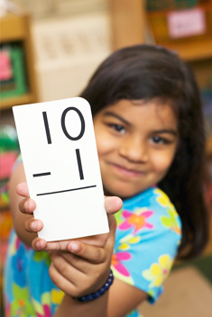 Student writing on chalkboard